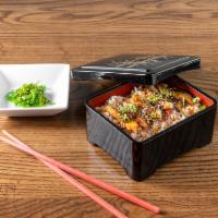 B-06. Eel Rice · 6 slices of BBQ unagi on a bed of rice, with seaweed salads.