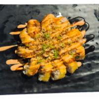 H-04. Hot Mama Roll · Tempura-fried roll with soft-shell crab, jalapeno, and cream cheese topped with tempura flak...