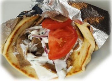 Gyro Wrap · Warm pita wrapped around choice of meat (beef, lamb, chicken, or falafel) with tomatoes and red onions topped off with tzatziki sauce.