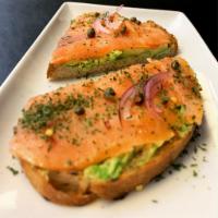 Smoked Salmon Avocado Toast · Sourdough Toast With Big Chunk of Fresh Cut Avocado, Smoked salmon, cream cheese, capers, re...