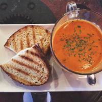Soup and Grilled Cheese Sandwich · Choice of tomato bisque or chicken noodle soup with white cheddar cheese on sourdough bread.