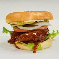 Crispy chicken burger (hot) · Mayo, pickles, onions, tomatoes on warm bun with lettuce and chicken tenders tossed in Nashv...