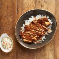 Chicken Katsu · Breaded chicken cutlet served over a bed of steamed rice and drizzled with katsu sauce and s...