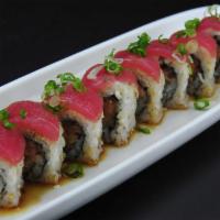 35. Pink Lady Roll · Contains raw fish. 8 pieces. In- spicy tuna. Top- tuna. Sauce- special garlic ponzu and gree...