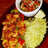 Sizzling Street Fajitas · A flavorful, sizzling dish of grilled steak, chicken or shrimp, served on top of a bed of sa...