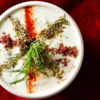 Cacik · Homemade yogurt mixed with chopped cucumber, blended with garlic, mint and dill. Vegetarian.