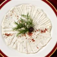 Haydari · Thick cream of yogurt, mixed with walnuts and garnished with fresh dill. Vegetarian.