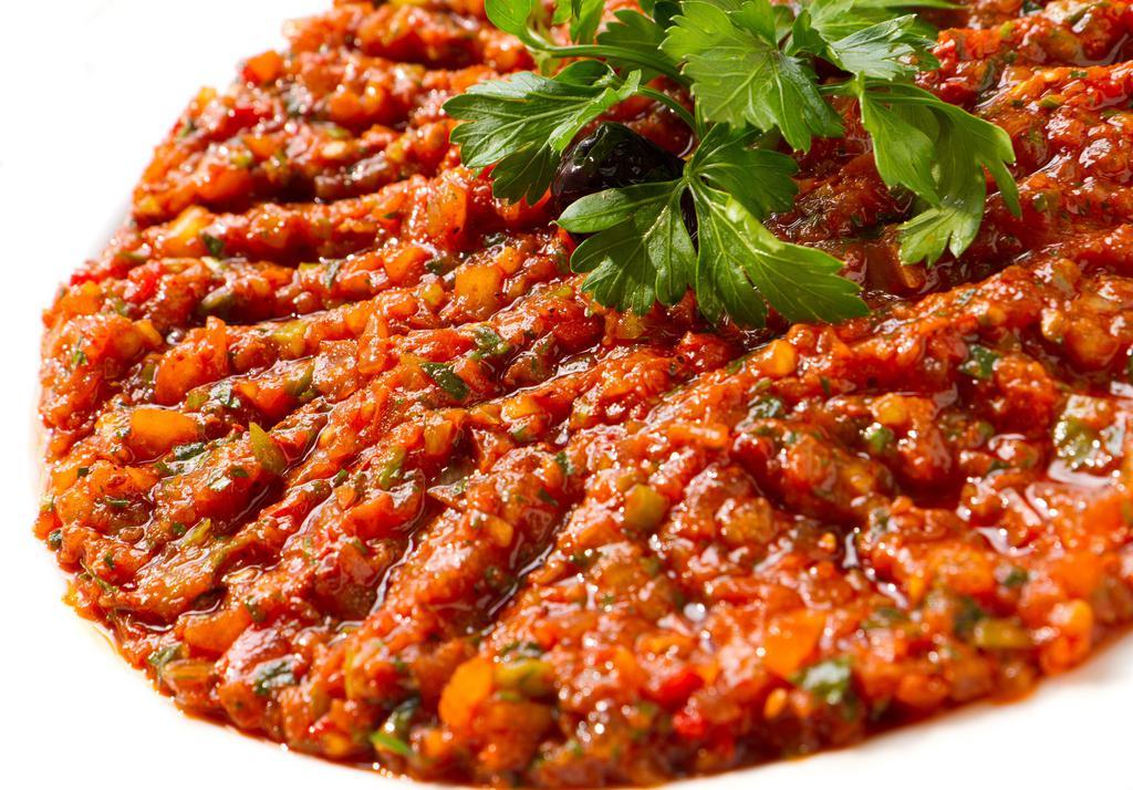 Muhammara · Red pepper, walnut and garlic dip flavored with warm spices.