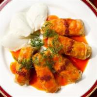 Etli Lahana Domasi · Cabbage stuffed with ground beef, rice and herbs, cooked with olive oil and tomato sauce, se...