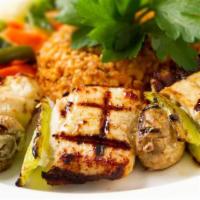 Mantarli Tavuk Sis · Char grilled skewered cuts of chicken breast and mushrooms, served with white rice and saute...