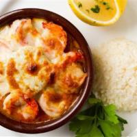 Karides Guvec · Baked shrimp, mushroom and tomato casserole, topped with kasseri cheese, served with white r...