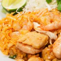 Pad Thai  · Stir-fried rice noodles, eggs, bean sprouts, green onions, and carrots topped with ground pe...