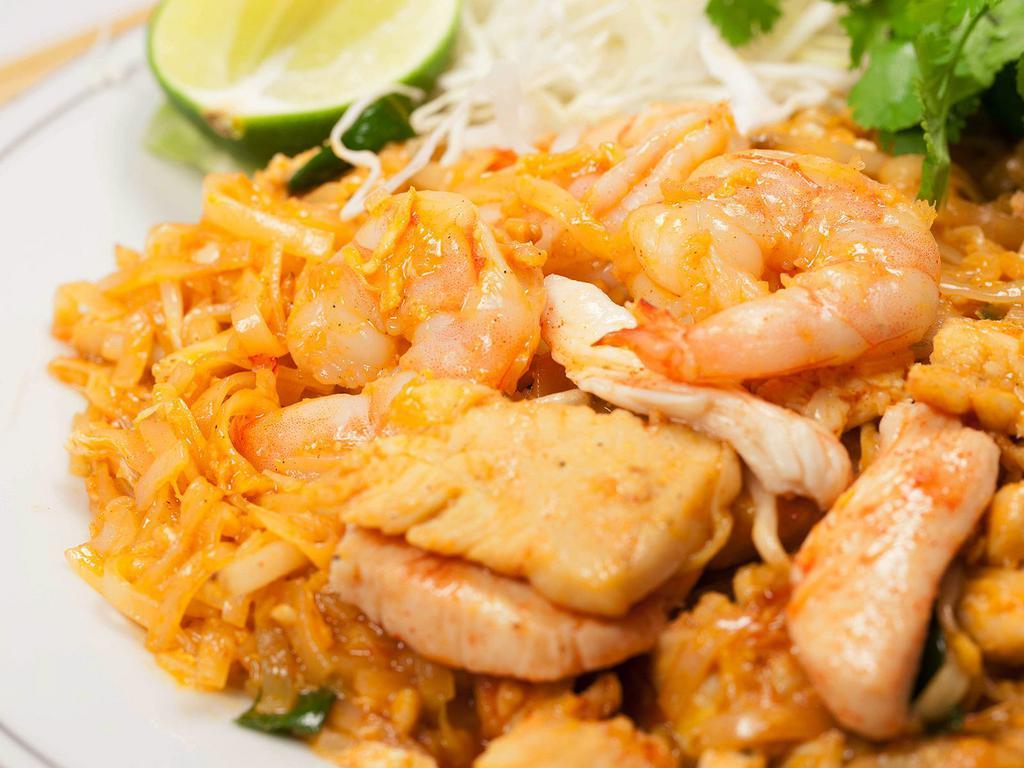 Pad Thai  · Stir-fried rice noodles, eggs, bean sprouts, green onions, and carrots topped with ground peanuts.
