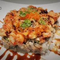B.L.C. · Baked langostino with butter and spicy mayo over California roll; with avocado, eel sauce, m...