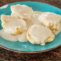 Biscuits and Gravy · Homemade biscuits covered with country style sausage gravy.