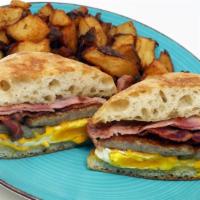 Cowboy breakfast Sandwich · 2 eggs,ham,bacon,sausage and American cheese