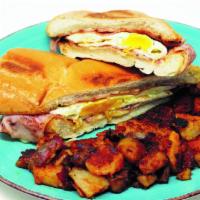 Cuban Breakfast Sandwich · 2 Fried Eggs with grilled Ham and Swiss cheese on toasted Cuban bread!
Served with a side of...