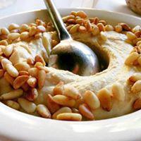 Hummos Pine Nuts · Topped with pan grilled pine nut.