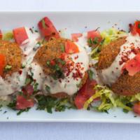 Falafel · 5 pieces. Falafel crispy croquette of fava, garbanzo beans with side tomatoes parsley and ta...