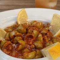 Spicy Olives · Pitted green olives marinated in pepper-paste sauce.