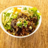 Ginger Beef Stir-Fry Bowl · Beef, ginger, onion fresh herbs, cucumber, pickled vegetables, topped with crispy shallots a...