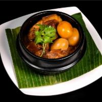 Vietnamese Caramelized Pork and Eggs(thit kho) · Pork, coconut juice, fish sauce, and fried eggs