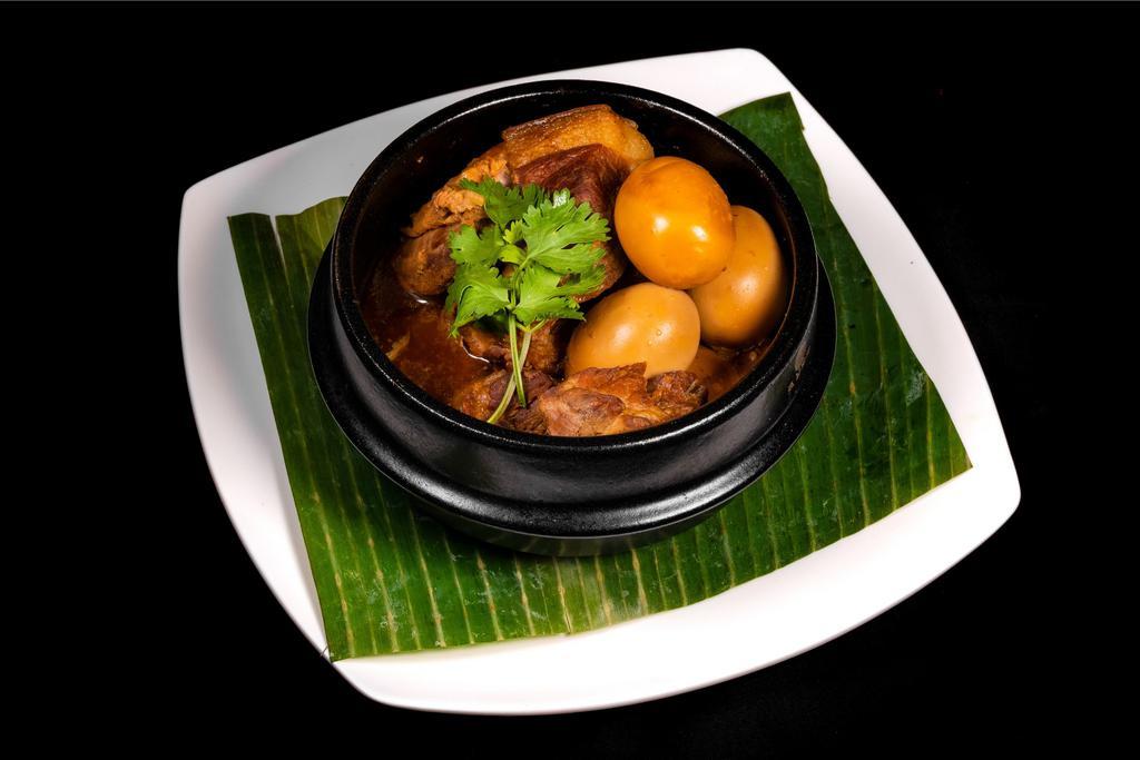 Vietnamese Caramelized Pork and Eggs(thit kho) · Pork, coconut juice, fish sauce, and fried eggs