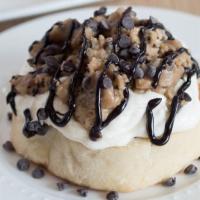 Cookie Monster Cinnamon Roll · Cream cheese topped with cookie dough, chocolate chips and chocolate drizzle.