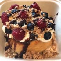 Mad Batter Cinnamon Roll · Cake batter, blueberries, raspberries, pie crumble and chocolate sauce.