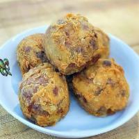 Boudin Ball · Taylor's Cajun Meats homemade Boudin mix is rolled into balls, battered, and ready to be fri...