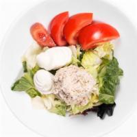 Albacore Tuna Salad · Tuna salad on crisp chilled greens with tomato and egg wedges. Choice of house made dressing.
