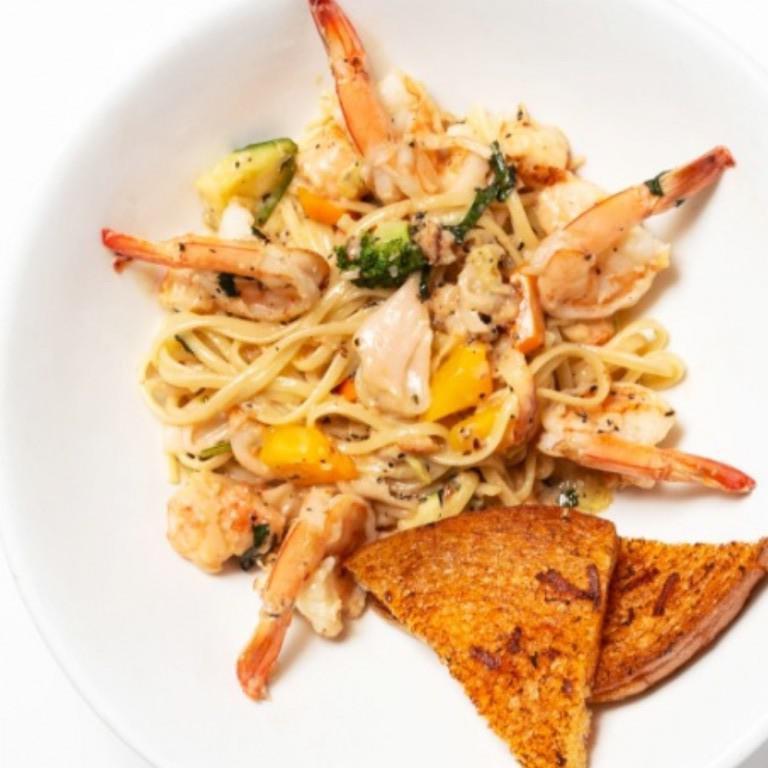Lobster and Shrimp Linguine · Sauteed lobster, grilled shrimp, sauteed julienne vegetables, fresh garlic, chopped tarragon with white wine reduction cream sauce and topped with Parmesan cheese. 