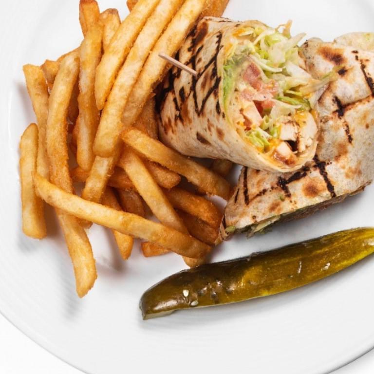 Southwest Chipotle Chicken Wrap · Grilled chicken breast, tomatoes, cheddar cheese, and jack cheese with house-made chipotle dressing, wrapped in a flour tortilla. Served with french fries.