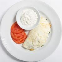 Vegetarian Egg White Omelette · Includes assorted fresh julienne vegetables and spinach served with sliced tomatoes and Cott...