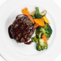 Filet Mignon · Angus filet served over mashed potatoes, seasonal vegetables with a chef special reduction s...