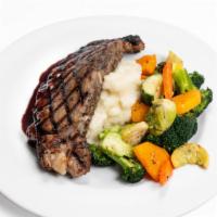 Angus Rib Eye Steak · Served with mashed potatoes and sauteed vegetables. We proudly serve 100% choice Angus beef....