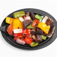 Sizzling Angus Beef Fajitas · Tender slices of beef sauteed with tomatoes, green peppers, onions and our own spices. Serve...