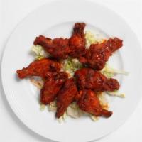 Hot Wings · Chicken wings marinated in our own spices and served with house made hot sauce.