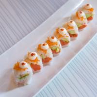 Romeo and Juliet Roll · Salmon, avocado, wrapped with soy paper, topped with Hokkaido scallop, mayo and tobiko. Serv...
