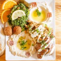 Meat Mezza Sampler · A variety of our appetizers. Includes hummus, baba ghanouj, rolled grape leaves, tabouli sal...