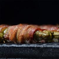 Bacon Wrapped Stuffed Jalapenos · Jalapenos stuffed with our pimento cheese, wrapped in bacon and smoked.