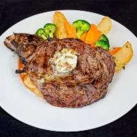 Ribeye Steak · grill ribeye served w/ roasted potatoes and seasonal vegetables