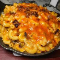 Buffalo Chicken Mac · Baked in a cast iron skillet topped with bacon and bleu cheese.