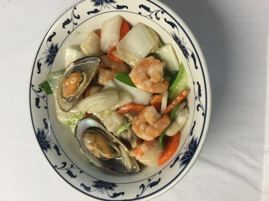 Mixed Seafood Delight · Shrimp, squid, mussels, scallops with filet of fish sauteed with fresh vegetables in a special white wine sauce. May contain bones.