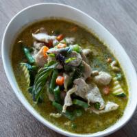 Green Curry Chicken · Coconut milk, chicken, green curry, basil, peas, carrots, green beans, zucchini and bell pep...