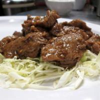 Garlic and Pepper Beef · Stir-fried beef, ground peppers, garlic, cabbage and cilantro. Served with jasmine or brown ...