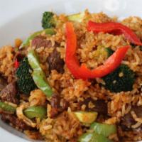 Spicy Fried Rice · Stir-fried rice with beef, fresh basil, bell peppers, egg, broccoli and onions.