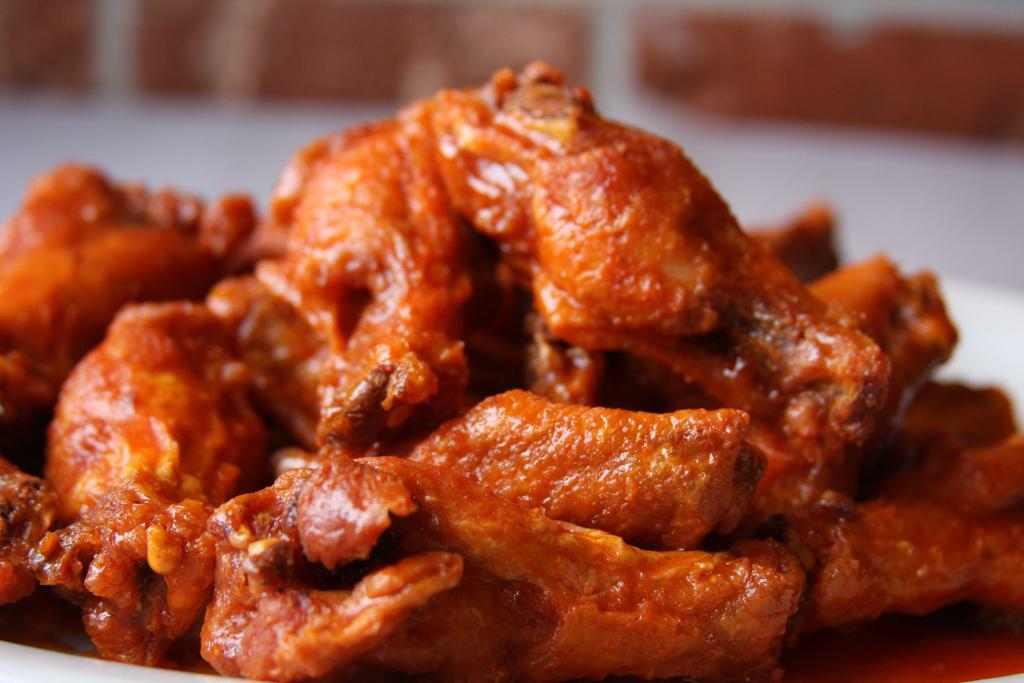 Traditional Wings · Served with celery, carrots and ranch. If you add an additional sauce we will split your wings equally between the flavors selected.