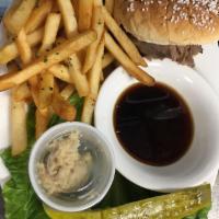 Roast Beef on Weck · Slow roasted roast beef piled high and served on freshly baked kimmelweck roll. Served with ...
