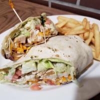 Chicken Caesar Wrap · Tender grilled chicken strips with crisp romaine lettuce, tomatoes and parmesan cheese tosse...